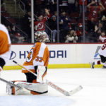 Philadelphia Flyers goaltender Samuel Ersson (33) reacts after giving up a goal to New Jersey Devils center Jack Hughes during the second period of an NHL hockey game Saturday, Feb. 25, 2023, in Newark, N.J. (AP Photo/Adam Hunger)