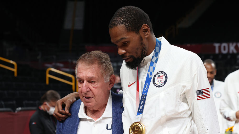 Kevin Durant and Jerry Colangelo celebrate during the Men's Basketball medal ceremony on day fiftee...