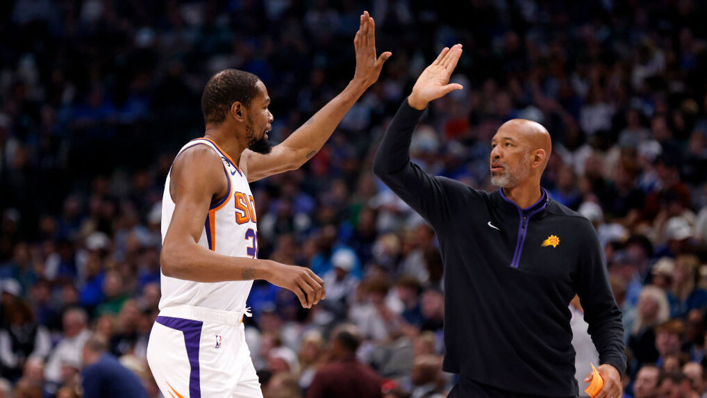 Kevin Durant #35 of the Phoenix Suns celebrates with his head coach Monty Williams as the Suns play...