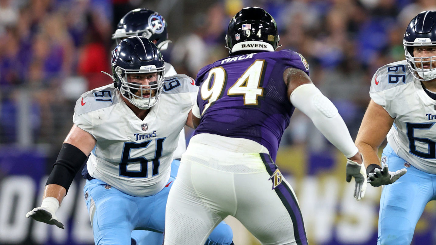 Hayden Howerton #61 and Carson Green #66 of the Tennessee Titans line up against Isaiah Mack #94 an...