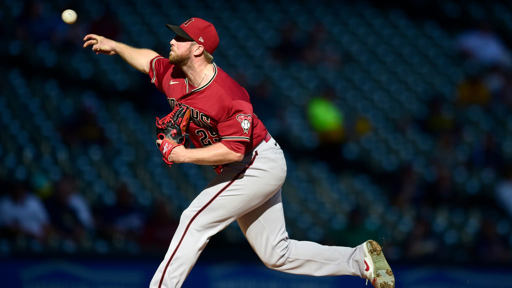 Merrill Kelly #29 of the Arizona Diamondbacks throws a pitch during the first inning against the Mi...