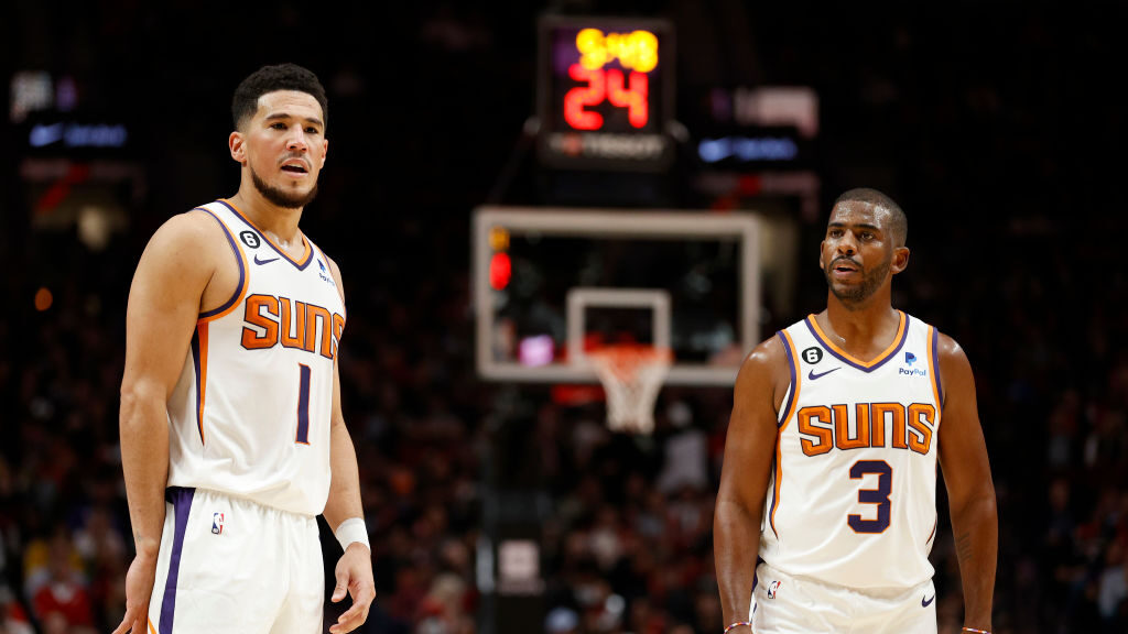 Devin Booker #1 and Chris Paul #3 of the Phoenix Suns look on during the third quarter against the ...