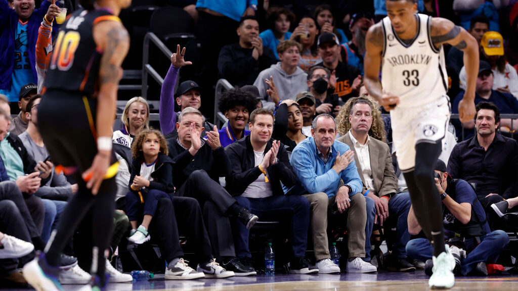 Incoming Phoenix Suns owner Mat Ishbia claps during the first half against the Brooklyn Nets at Foo...