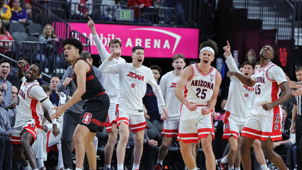 Courtney Ramey #0, Kerr Kriisa #25 and Cedric Henderson Jr. #45 of the Arizona Wildcats react after...