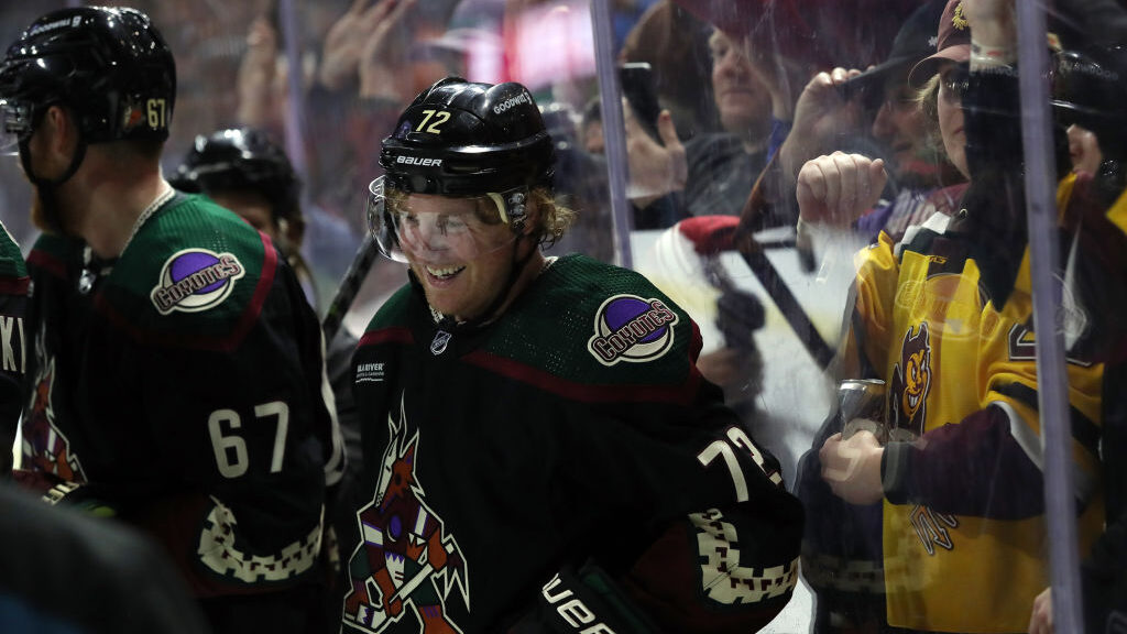 Travis Boyd #72 of the Arizona Coyotes celebrates a game-winning goal in overtime against the Calga...