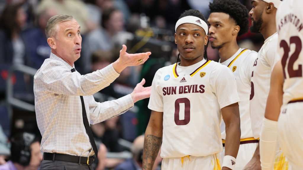 Head coach Bobby Hurley of the Arizona State Sun Devils speaks to his team during a timeout against...