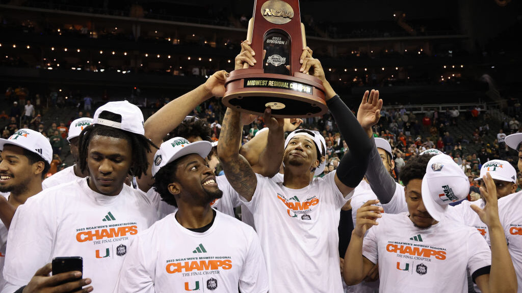 The Miami Hurricanes hoist the trophy after defeating the Texas Longhorns 88-81 in the Elite Eight ...