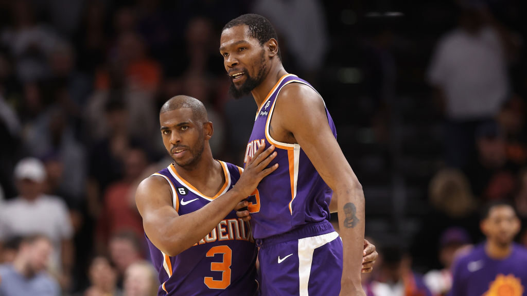Chris Paul #3 and Kevin Durant #35 of the Phoenix Suns celebrate after defeating the Minnesota Timb...
