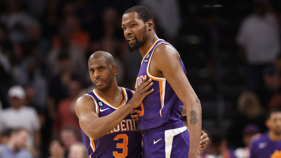 Chris Paul #3 and Kevin Durant #35 of the Phoenix Suns celebrate after defeating the Minnesota Timb...