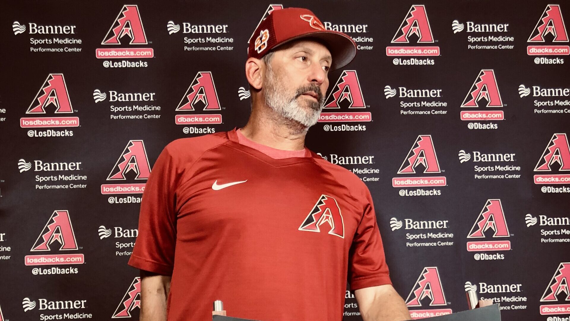 Arizona Diamondbacks manager Torey Lovullo speaks with reporters after a 7-4 spring training loss t...
