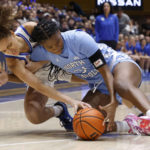 
              Duke's Celeste Taylor, left, and North Carolina's Anya Poole dive for the ball during the first half of an NCAA college basketball game Sunday, Feb. 26, 2023, in Durham, N.C. (Kaitlin McKeown/The News & Observer via AP)
            