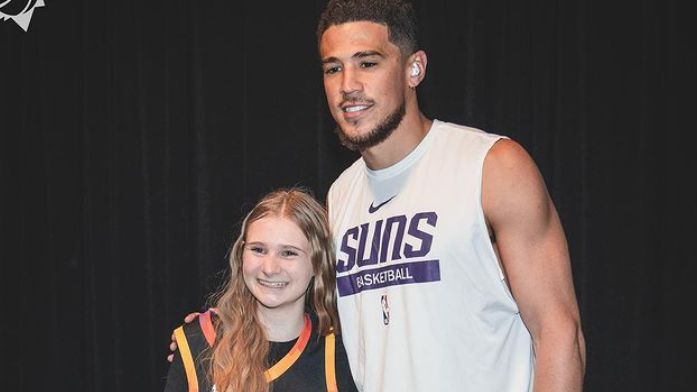 A young fan meets Devin Booker at Crypto.com Arena in Los Angeles. (Photo by suns and phxoffcourt I...