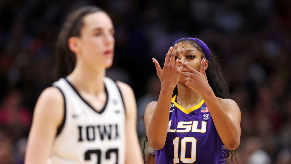 Angel Reese #10 of the LSU Lady Tigers reacts towards Caitlin Clark #22 of the Iowa Hawkeyes during...