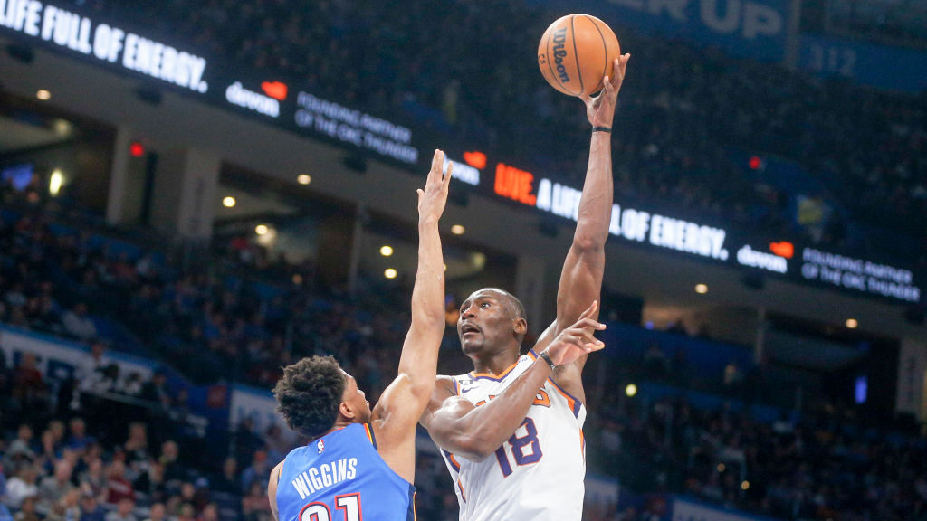 Bismack Biyombo #18 of the Phoenix Suns shoots against Aaron Wiggins #21 of the Oklahoma City Thund...