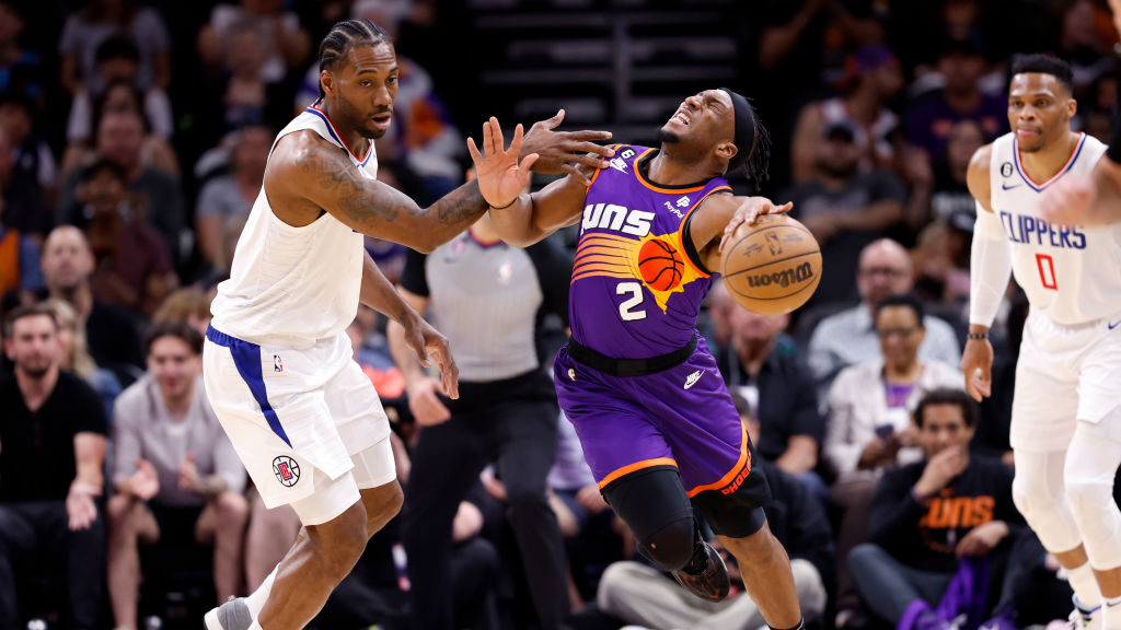 Kawhi Leonard #2 of the Los Angeles Clippers fouls Josh Okogie #2 of the Phoenix Suns during the fi...