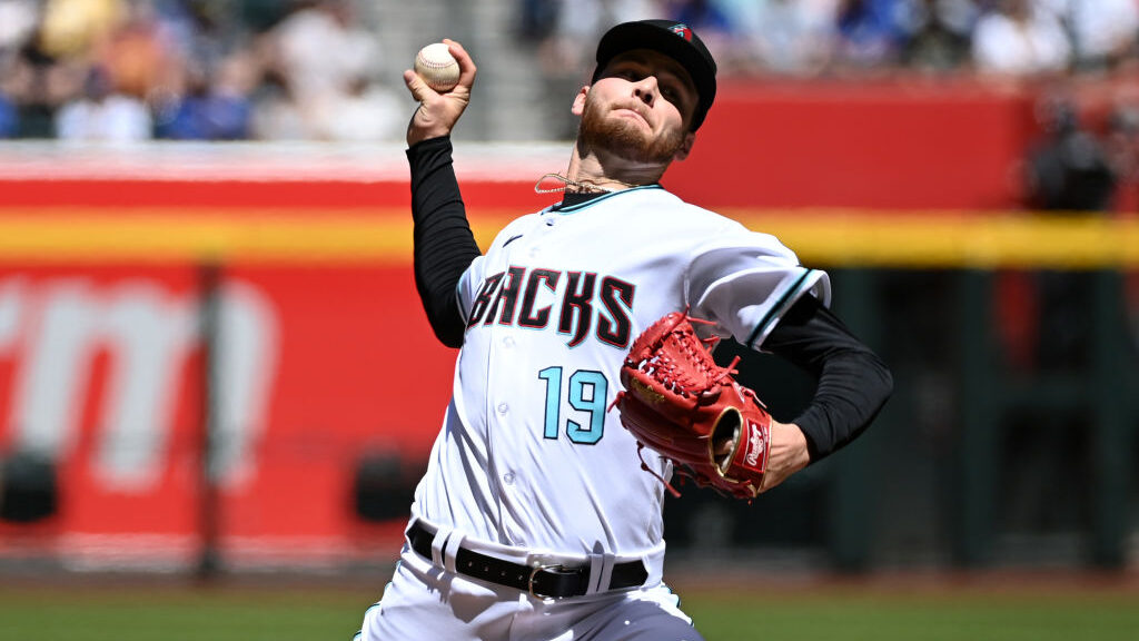 Ryne Nelson #19 of the Arizona Diamondbacks delivers a pitch against the Los Angeles Dodgers at Cha...