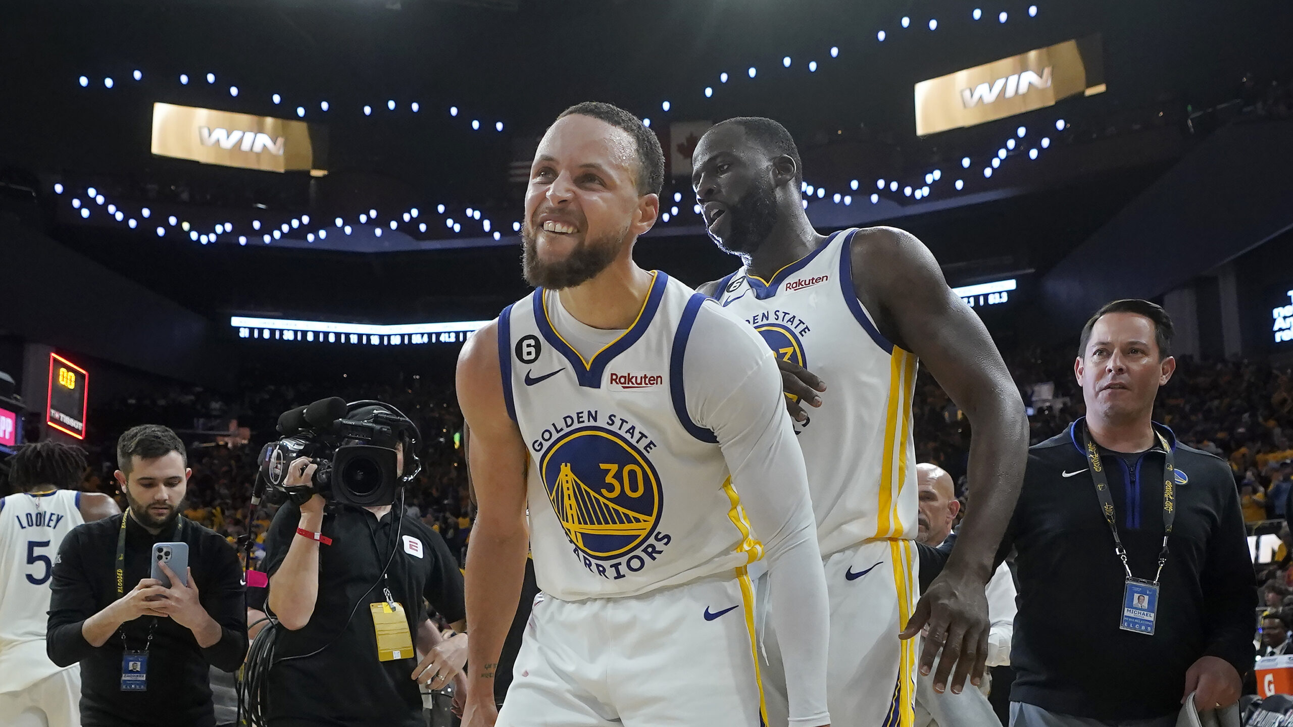Golden State Warriors guard Stephen Curry (30) celebrates with forward Draymond Green after the War...