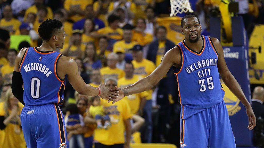 Russell Westbrook #0 and Kevin Durant #35 of the Oklahoma City Thunder celebrate after a play again...