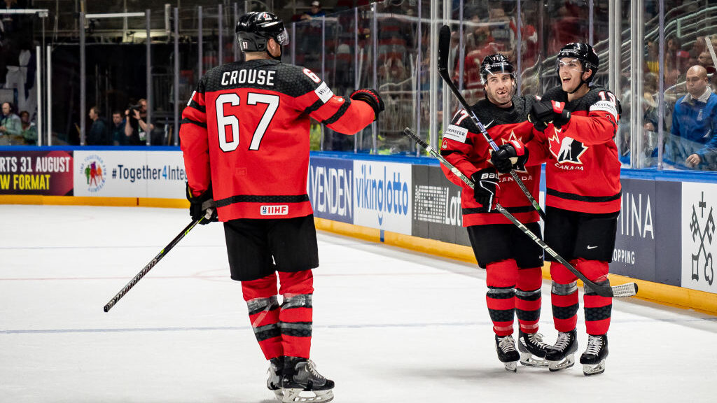 Lawson Crouse of Canada, Milan Lucic of Canada and Peyton Krebs of Canada Team Canada celebrates af...