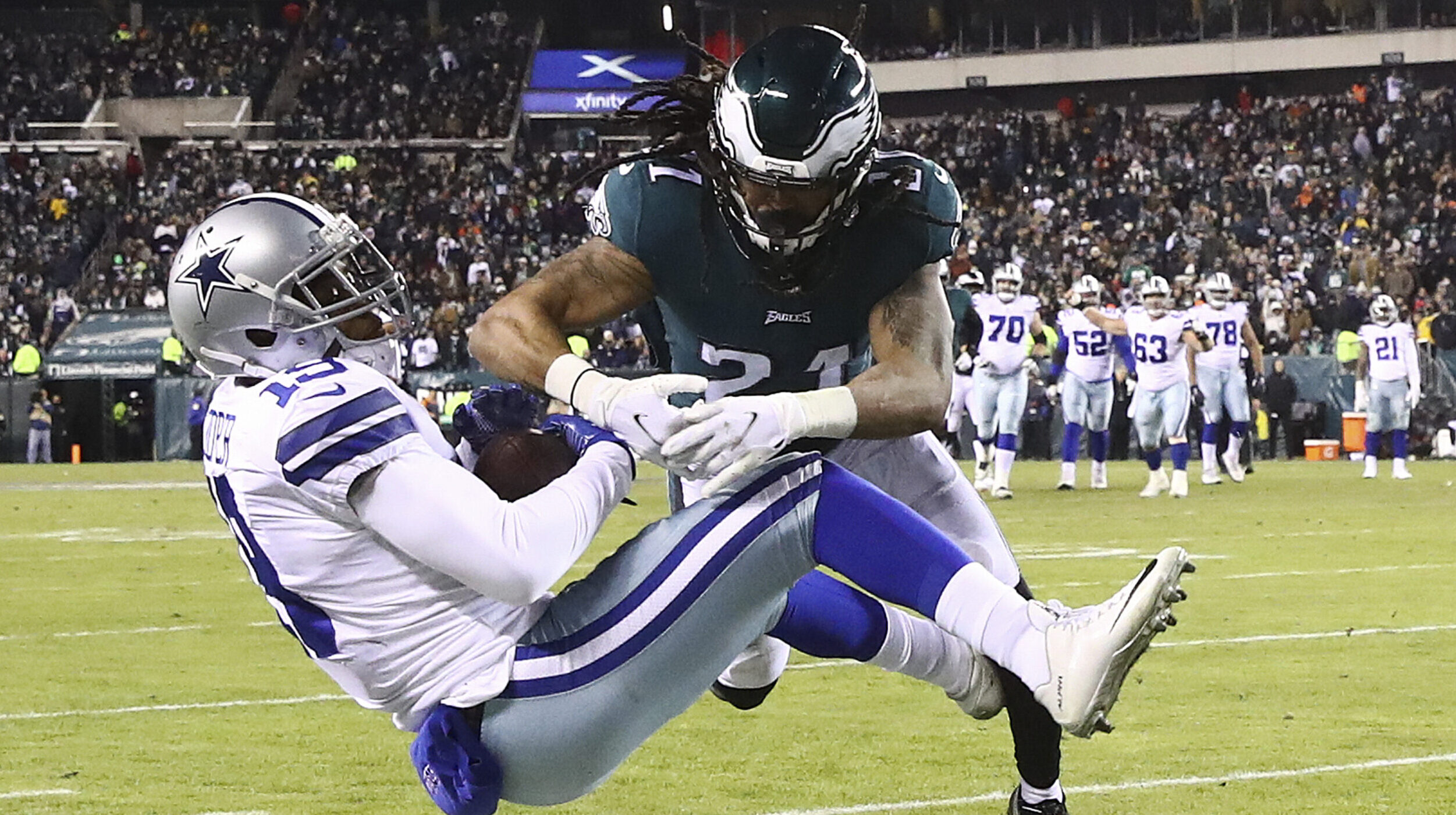 Andre Chachere #21 of the Philadelphia Eagles hits Amari Cooper #19 of the Dallas Cowboys at Lincol...