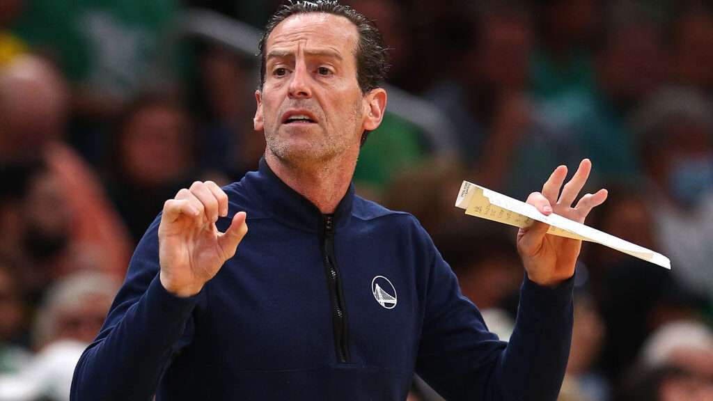 Assistant coach Kenny Atkinson of the Golden State Warriors reacts against the Boston Celtics durin...