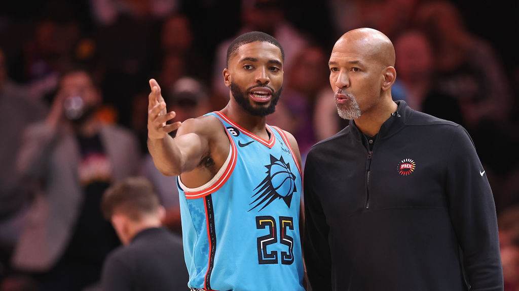 Mikal Bridges #25 of the Phoenix Suns talks with head coach Monty Williams during the second half o...
