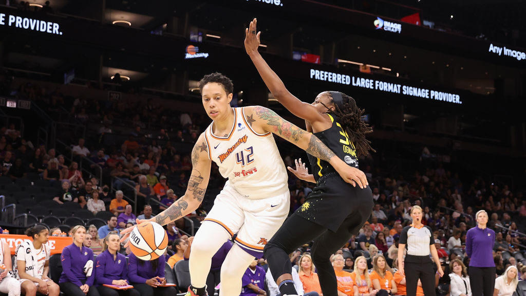 Brittney Griner #42 of the Phoenix Mercury handles the ball against Chiney Ogwumike #13 of the Los ...