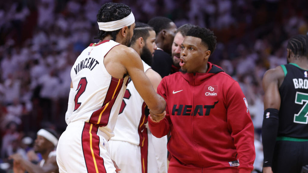 Gabe Vincent #2 and Kyle Lowry #7 of the Miami Heat react after a timeout during the third quarter ...