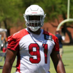 Arizona Cardinals DL L.J. Collier looks on during voluntary OTAs on Monday, May 22, 2023, in Tempe. (Tyler Drake/Arizona Sports)