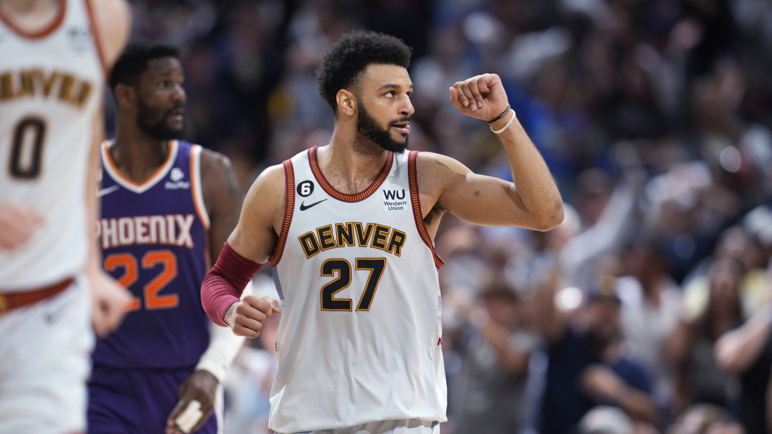 Denver Nuggets guard Jamal Murray gestures after hitting a 3-point basket against the Phoenix Suns ...