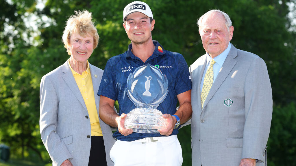 Viktor Hovland of Norway poses with the trophy and `1and his wife Barbara Nicklaus after winning th...