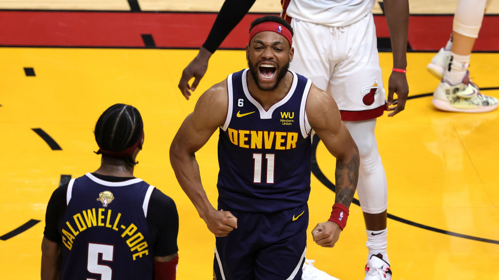 Bruce Brown #11 of the Denver Nuggets reacts after making a basket and drawing a foul during the fo...