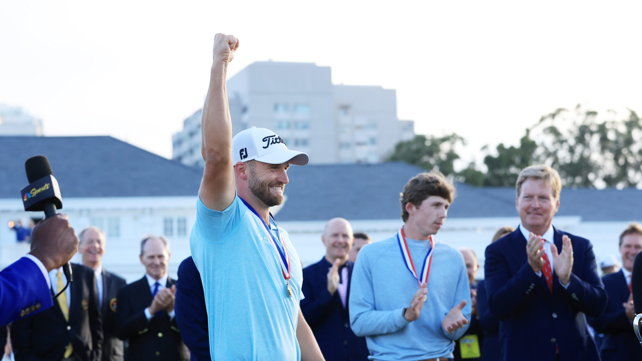 Wyndham Clark of the United States reacts after his winning putt on the 18th green during the final...