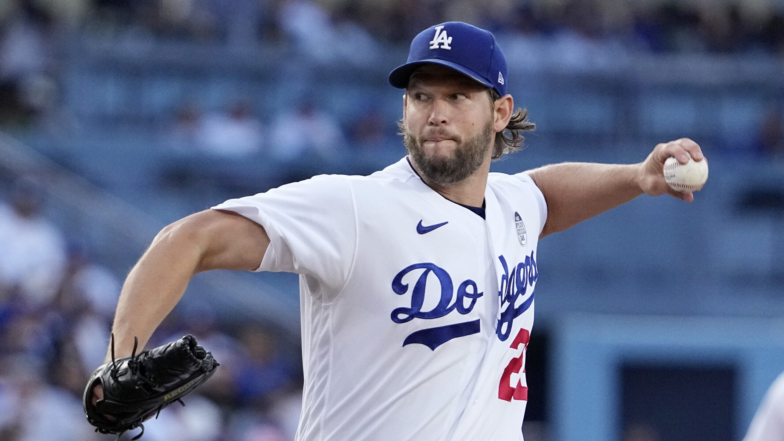 Los Angeles Dodgers starting pitcher Clayton Kershaw throws to the plate during the first inning of...
