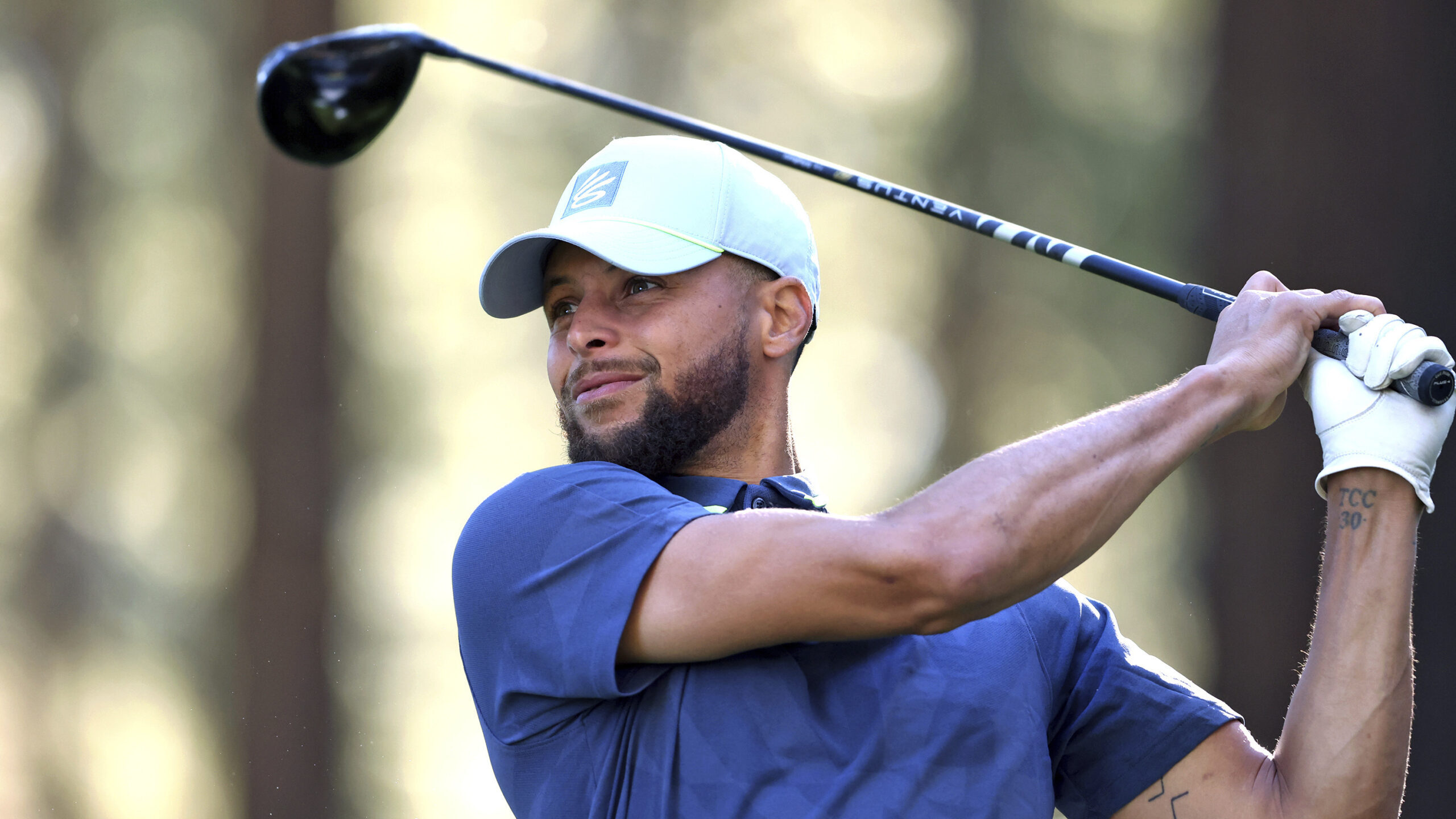 Stephen Curry watches a tee shot on the 16th hole during a practice round at American Century Champ...
