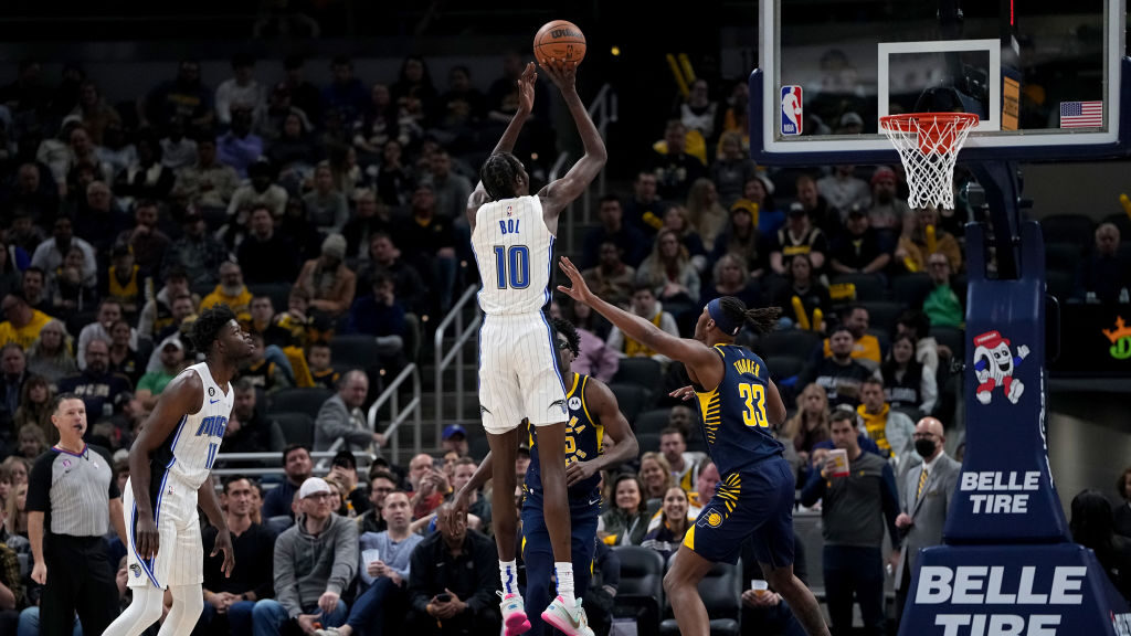 Bol Bol #10 of the Orlando Magic attempts a shot while being guarded by Myles Turner #33 of the Ind...