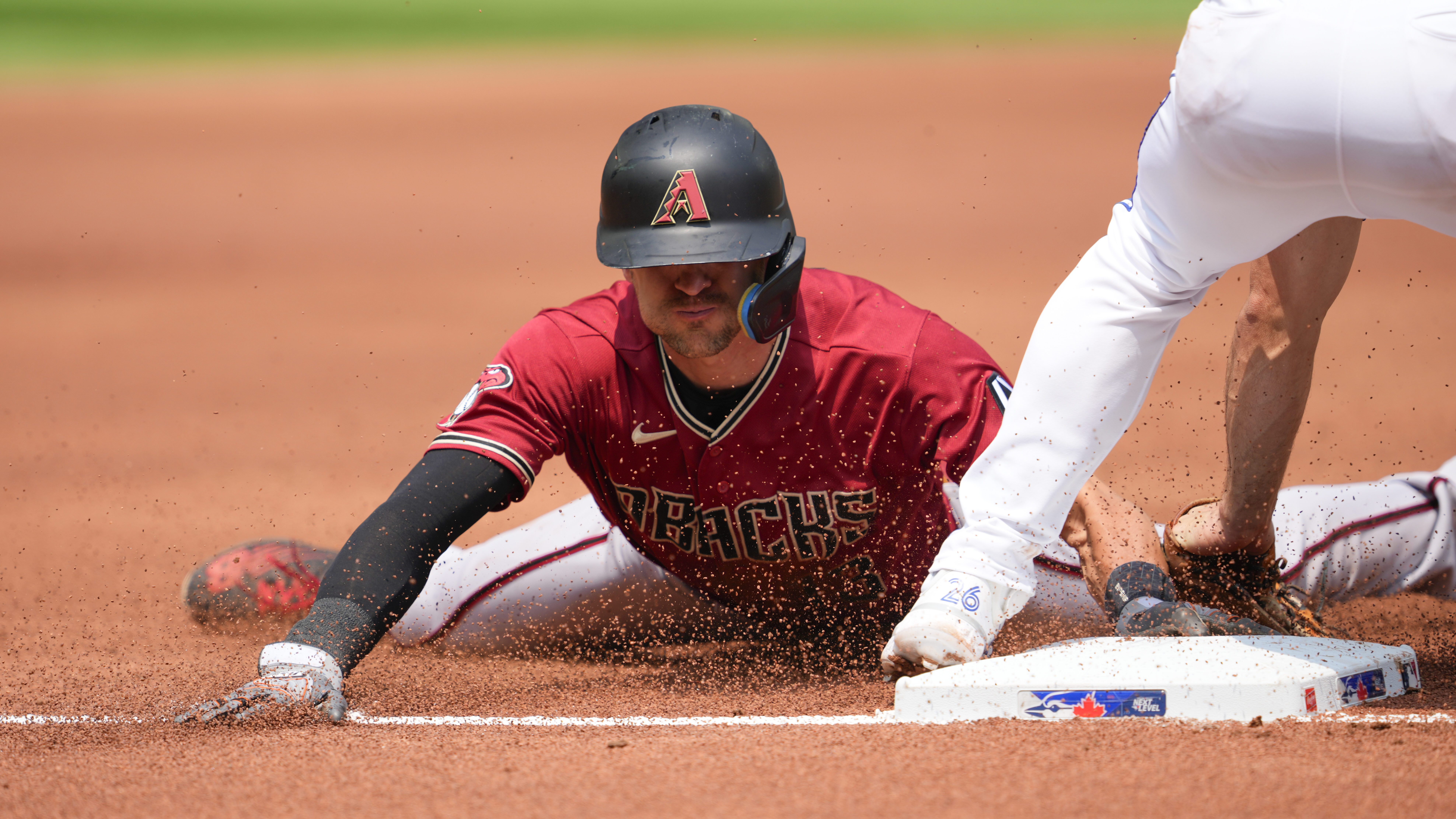 Nick Ahmed #13 of the Arizona Diamondbacks steals third base during the second inning against the T...