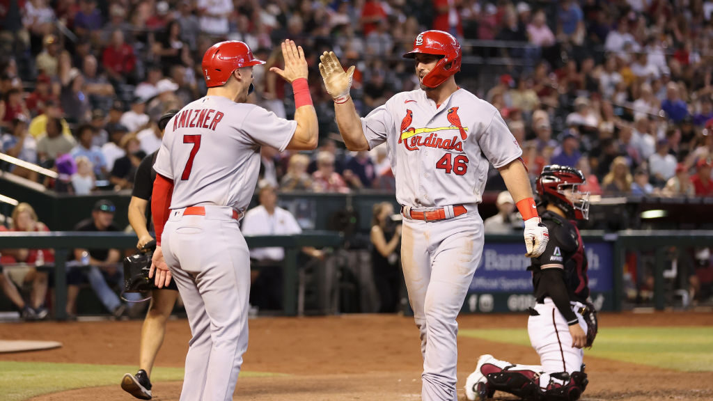 Paul Goldschmidt #46 of the St. Louis Cardinals high fives Andrew Knizner #7 after hitting a two-ru...