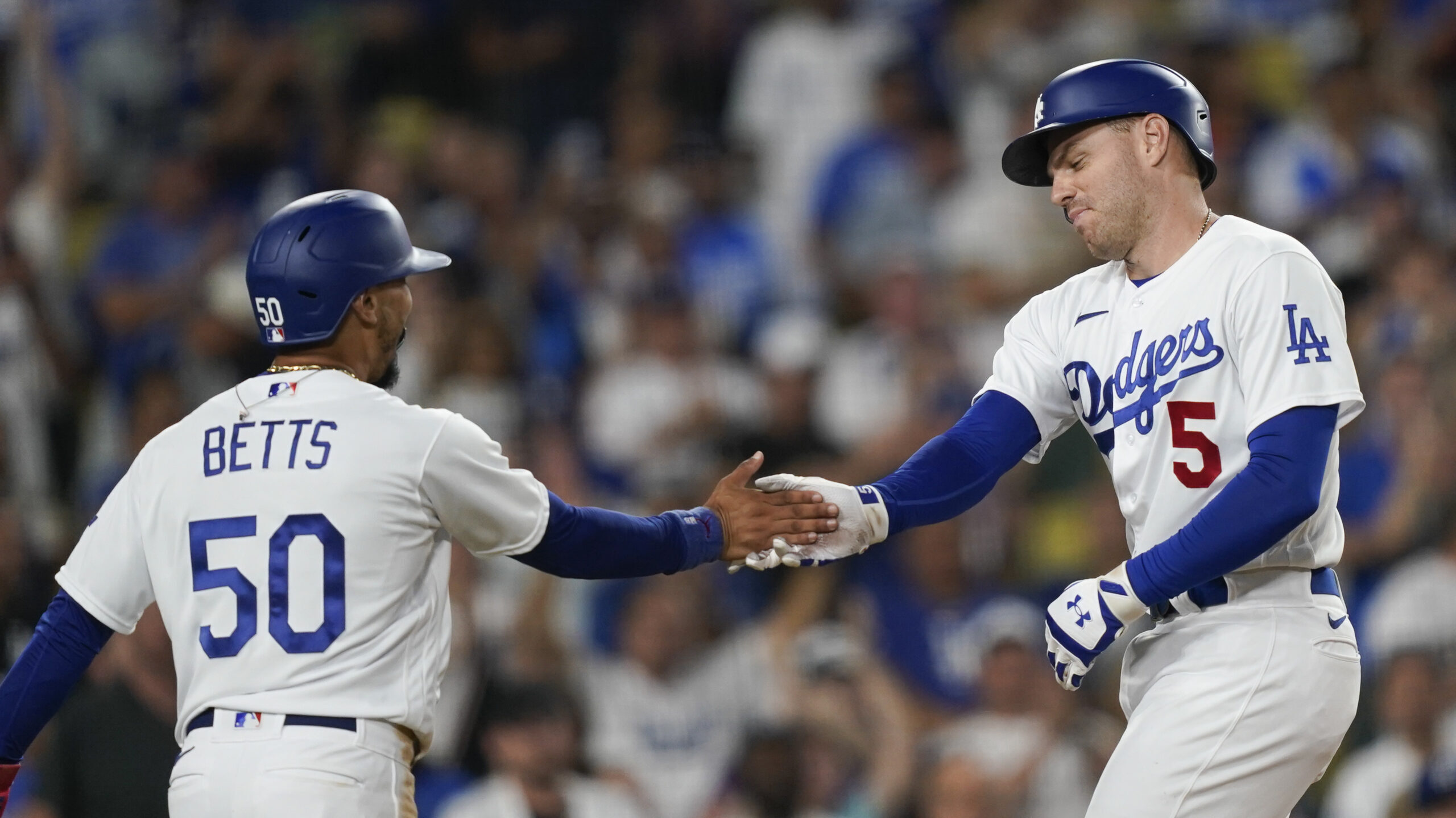 Los Angeles Dodgers' Freddie Freeman (5) celebrates his two-run home run against the Arizona Diamon...