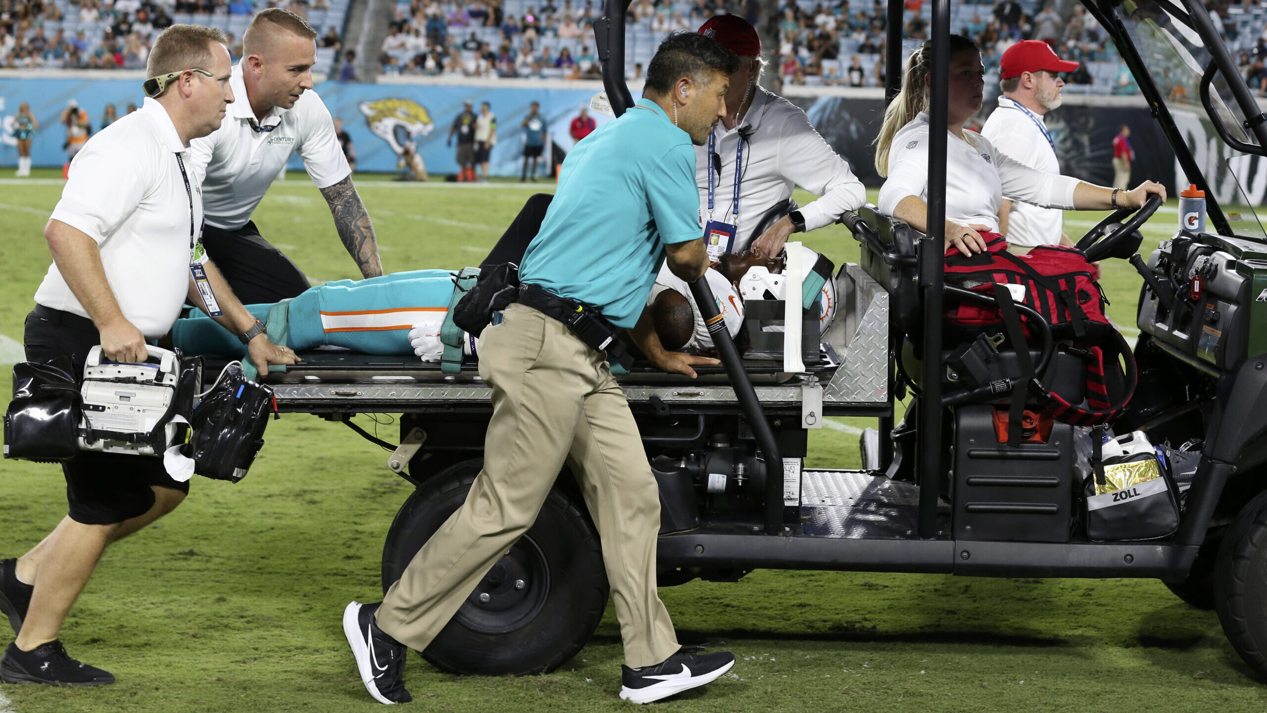 Miami Dolphins wide receiver Daewood Davis is carted off the field during the second half of an NFL...