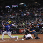 Texas Rangers catcher Jonah Heim strikes out (Felisa Cardenas/Arizona Sports)