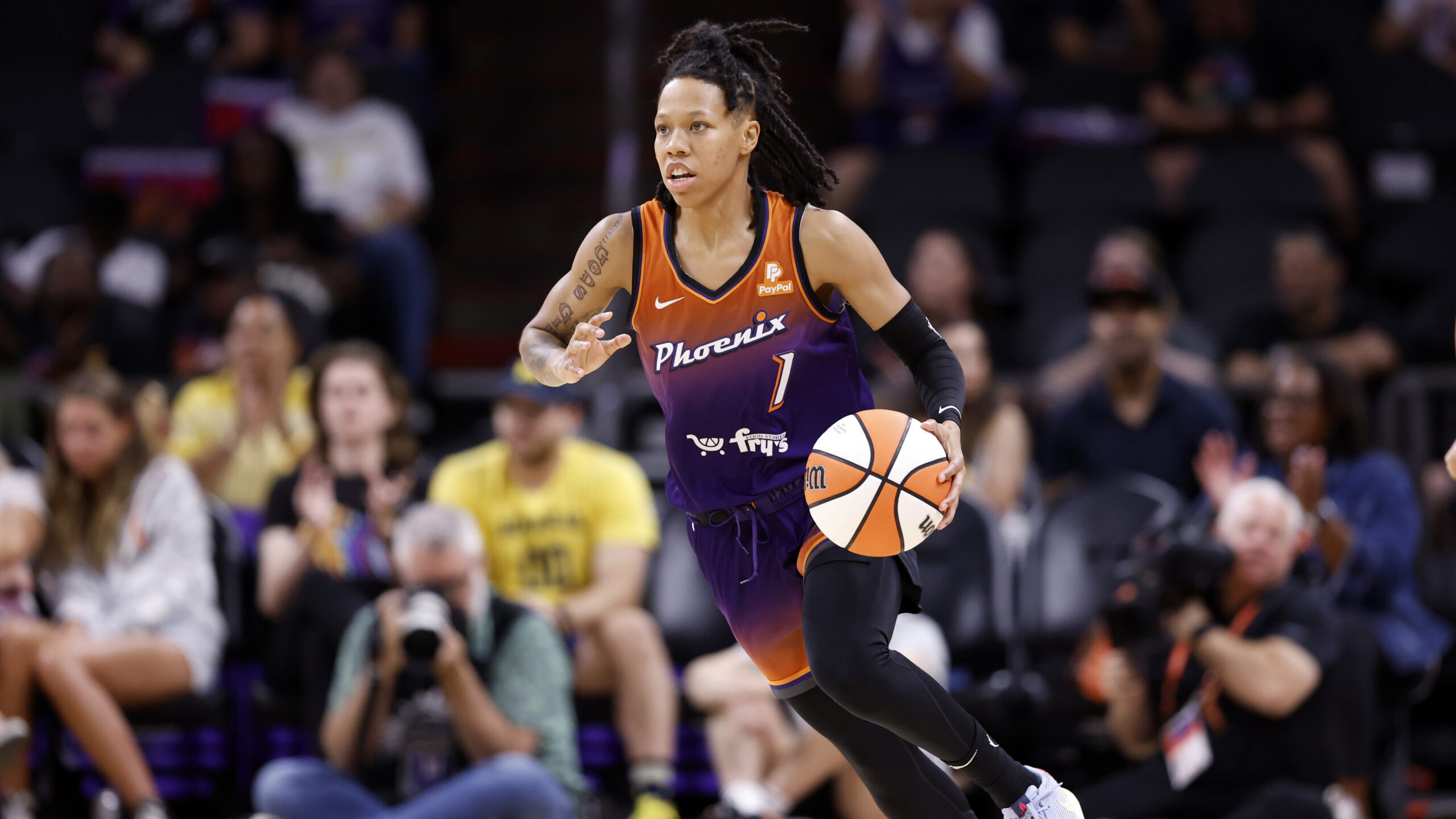 Guard Sug Sutton #1 of the Phoenix Mercury dribbles the ball during the first half against the Atla...