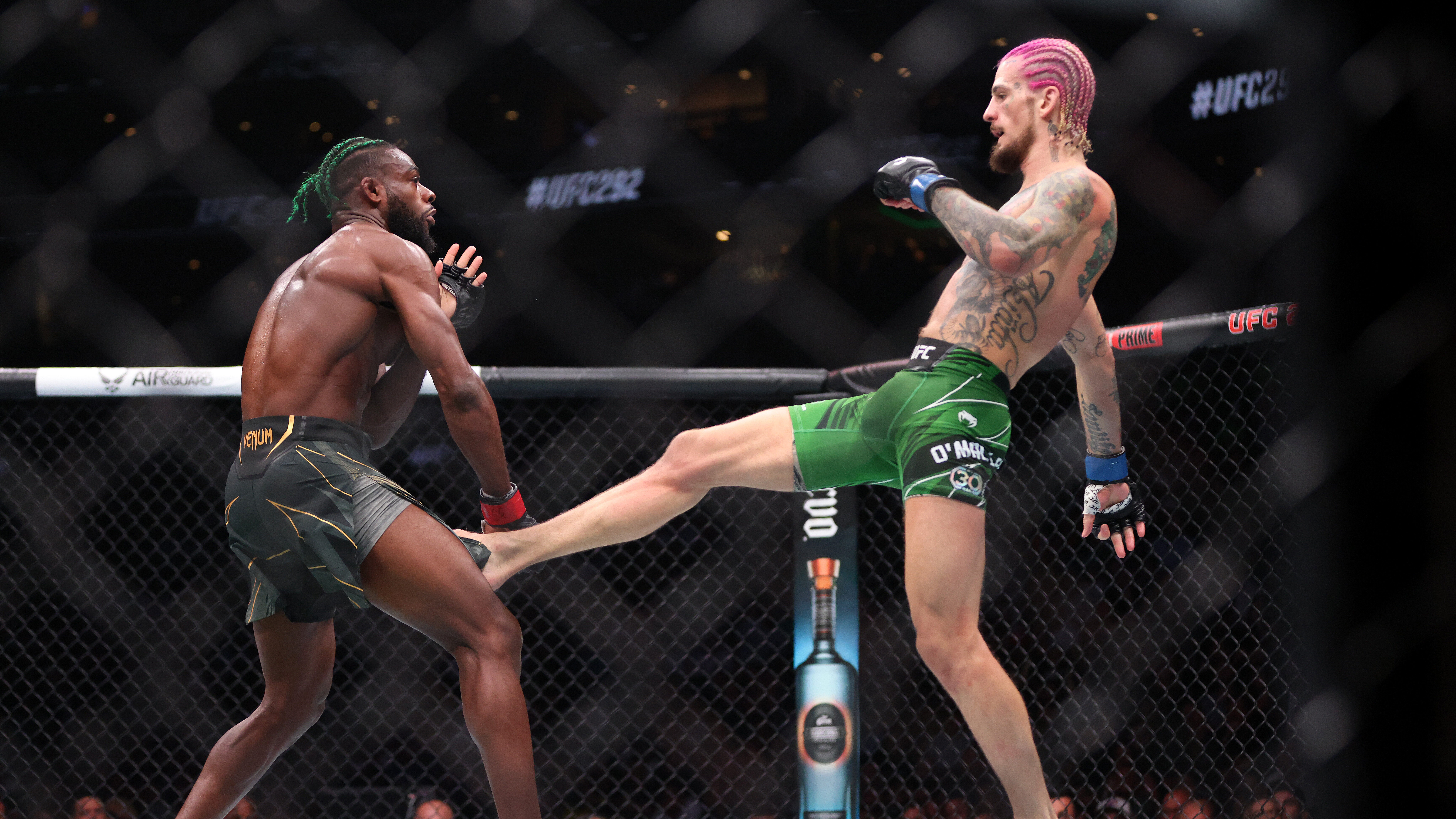 Sean O’Malley throws a kick against Aljamain Sterling during their Bantamweight title fight at UF...