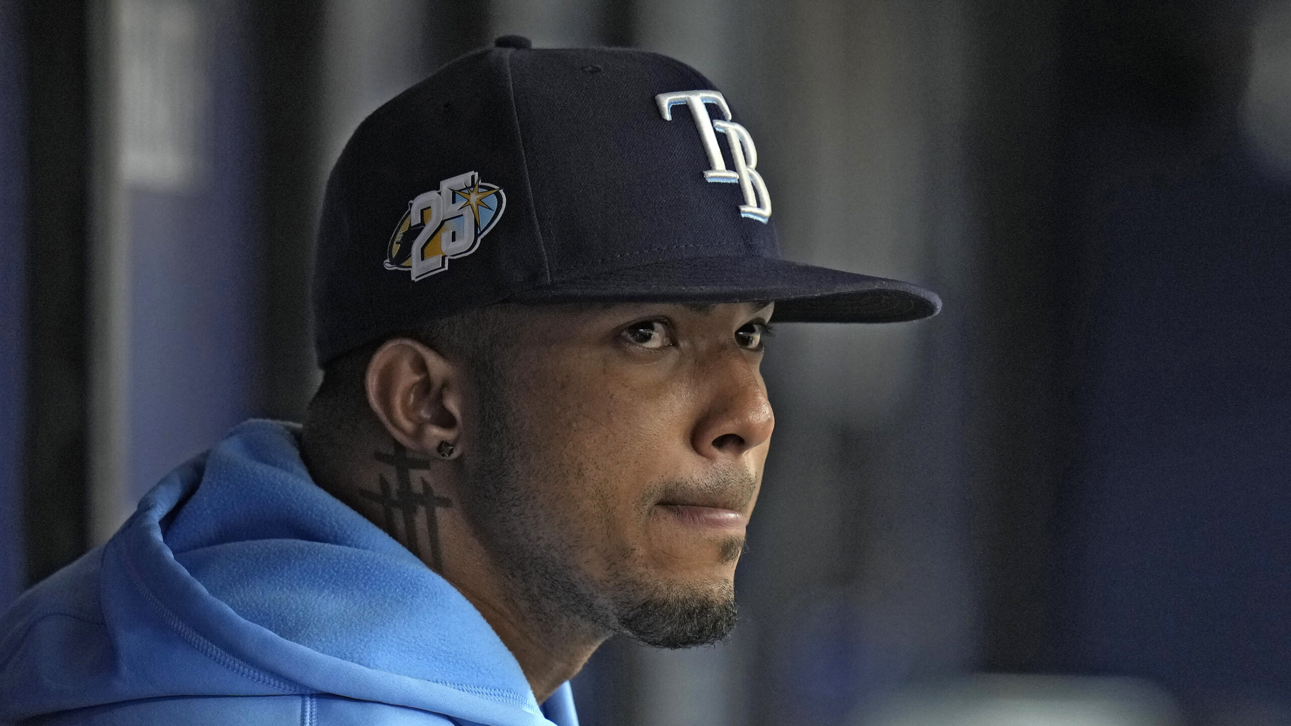 Tampa Bay Rays' Wander Franco watches from the dugout during the fifth inning of a baseball game ag...