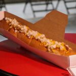The Shotgun Dog -- Giant 22-inch Vienna beef hot dog topped with beef chili, shredded sharp cheddar cheese and diced onions served on an oven-fresh bun: Club level. (Tyler Drake/Arizona Sports)