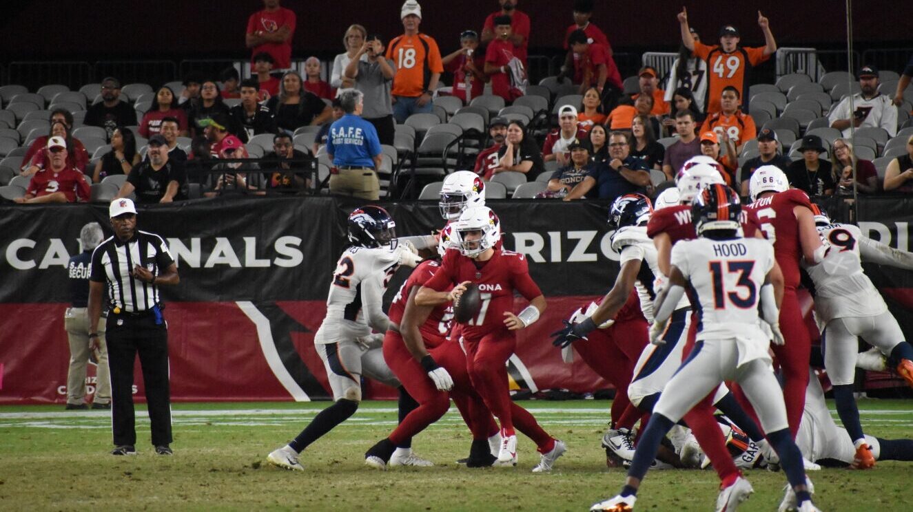 Arizona Cardinals quarterback David Blough (17) scrambles away from the pocket against the Denver B...