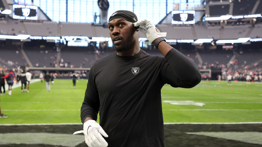 Defensive end Chandler Jones #55 of the Las Vegas Raiders talks to fans before a game against the N...