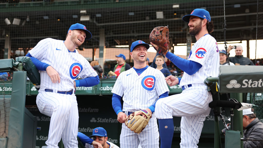 Ian Happ #8, Nico Hoerner #2 and Dansby Swanson #7 of the Chicago Cubs look on prior to the game ag...