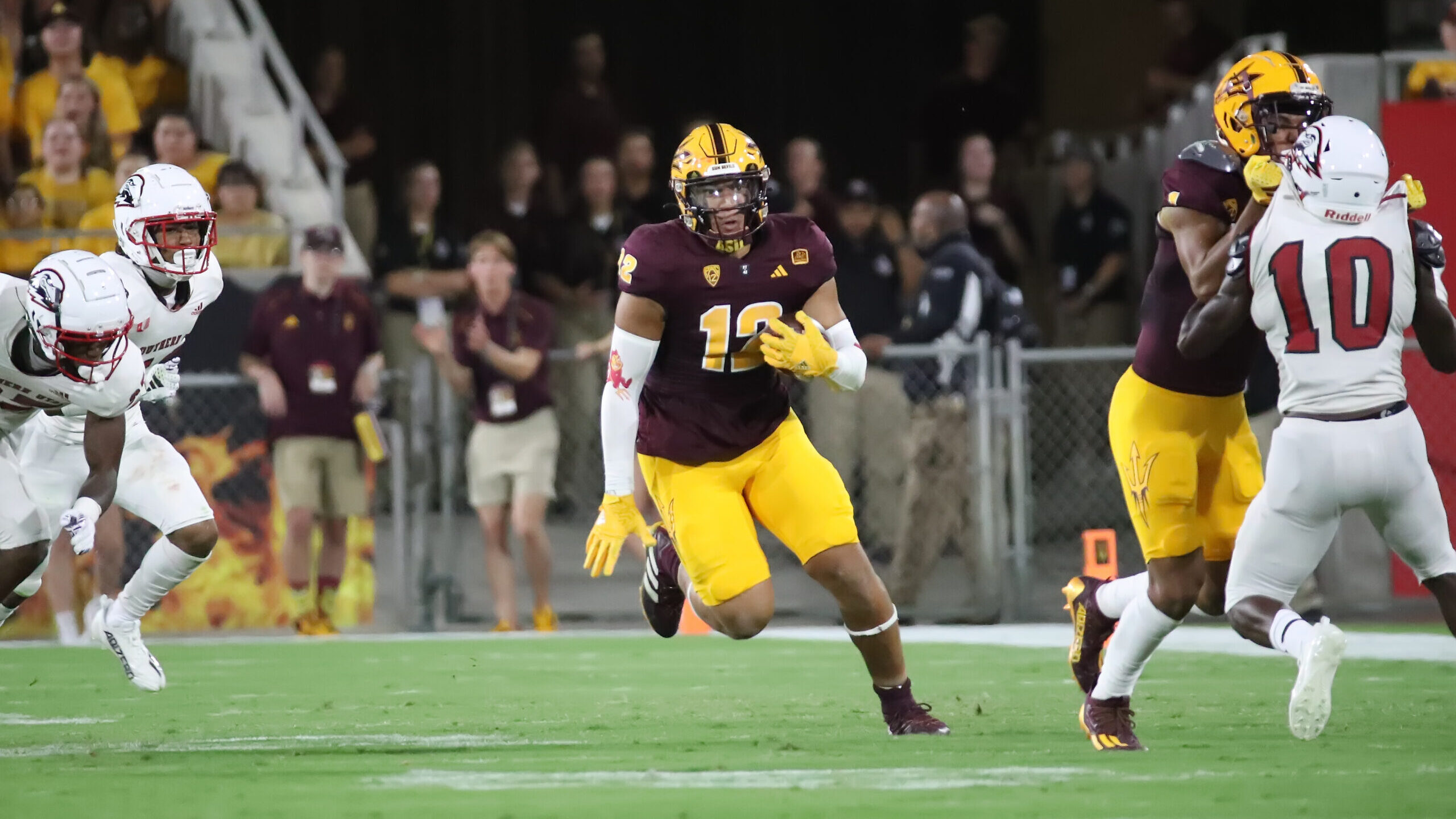 Jalin Conyers #12 of the Arizona State Sun Devils runs towards the open field against the Southern ...