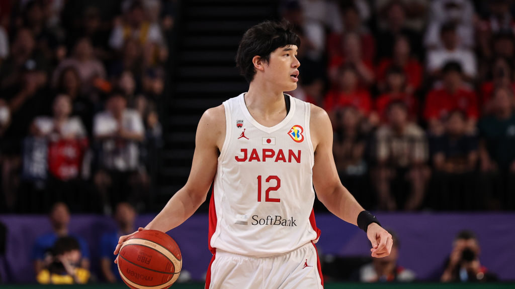 Yuta Watanabe #12 of Japan dribbles the ball during the FIBA Basketball World Cup Classification 17...